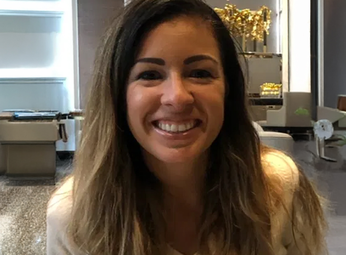 Wellness partner headshot of smiling health and fitness professional.