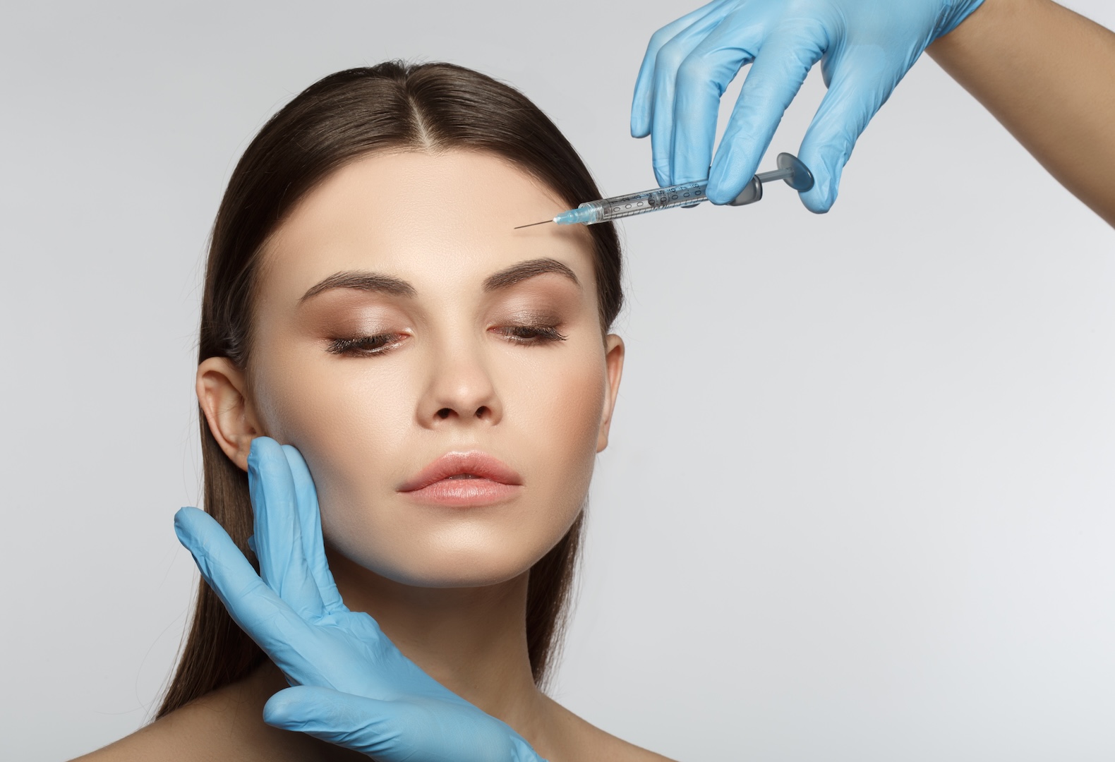 woman having injection in forehead