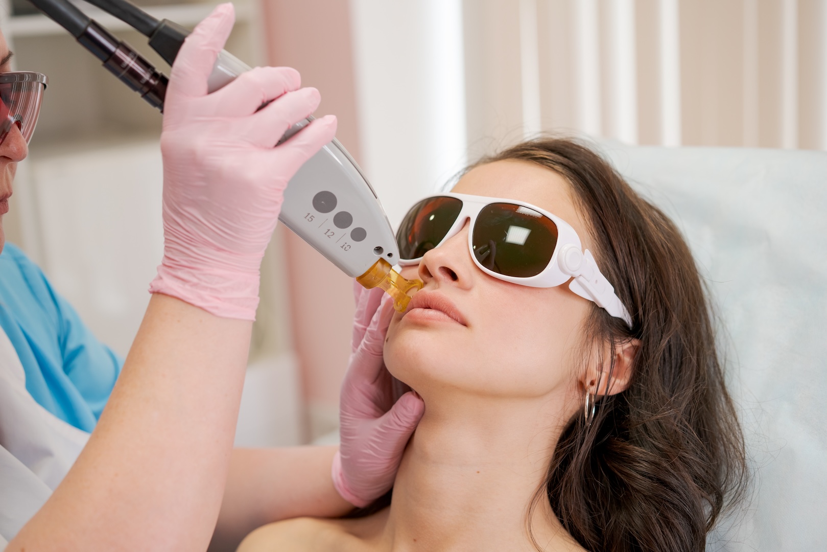 woman wearing dark glasses with instrument on her face