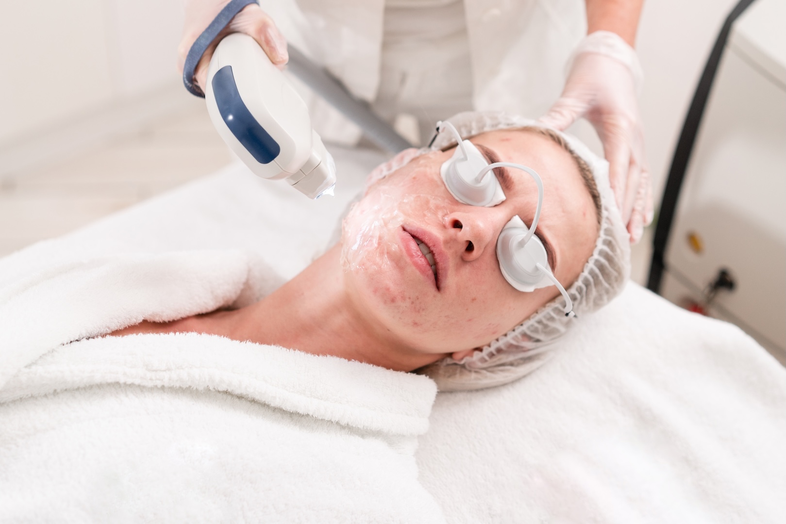 person wearing protective goggles undergoing treatment