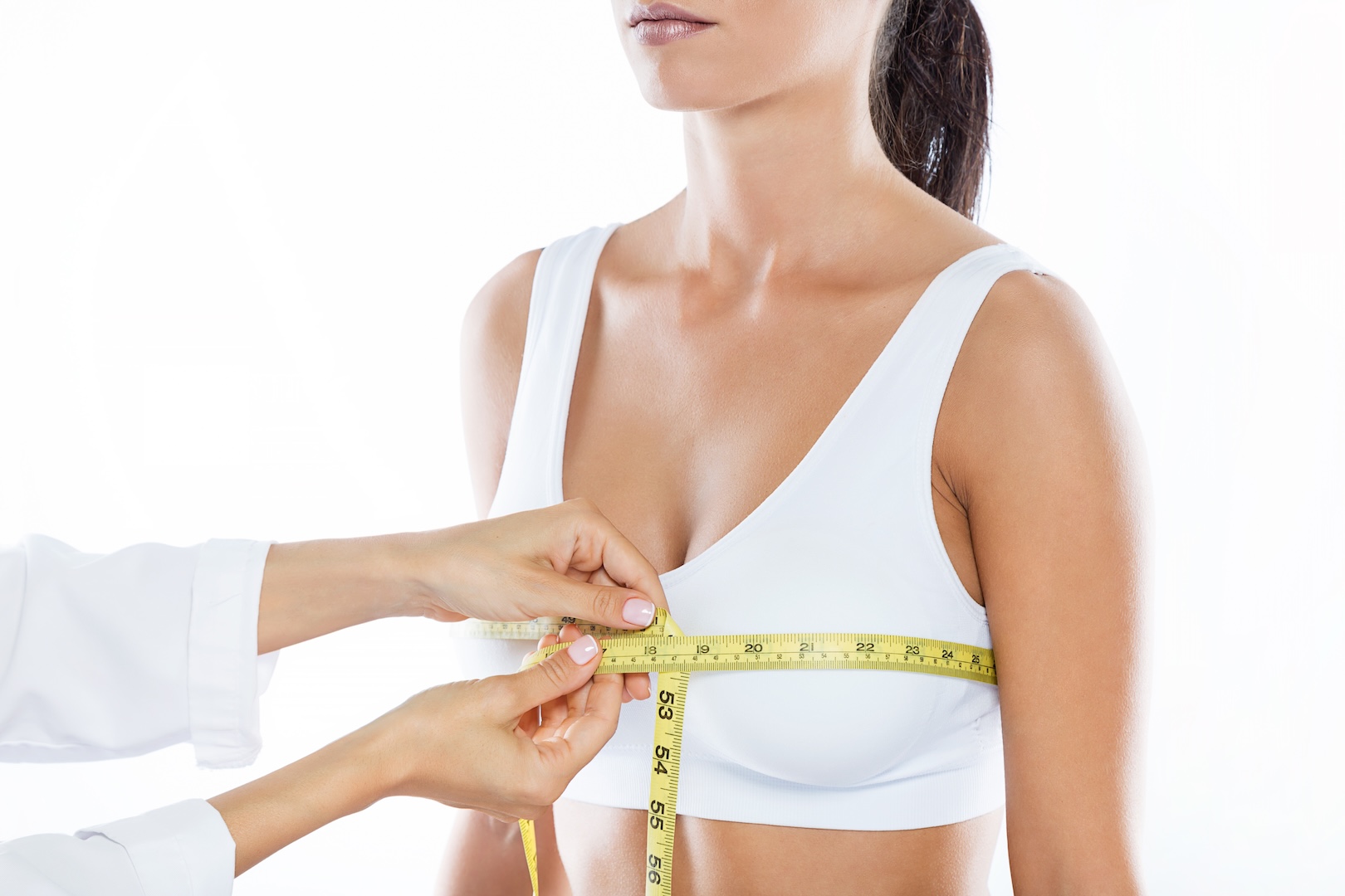 woman with tape measure around chest