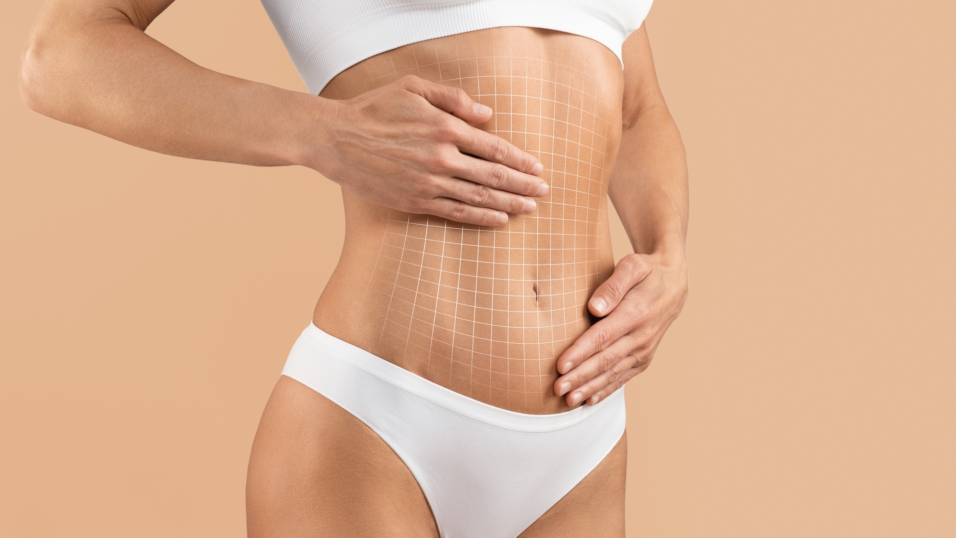 woman touching stomach