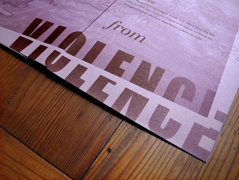 Interior spread of a brochure focusing on the words "from violence" set in decorative font on a purple duotone background. The word "violence" is split apart.