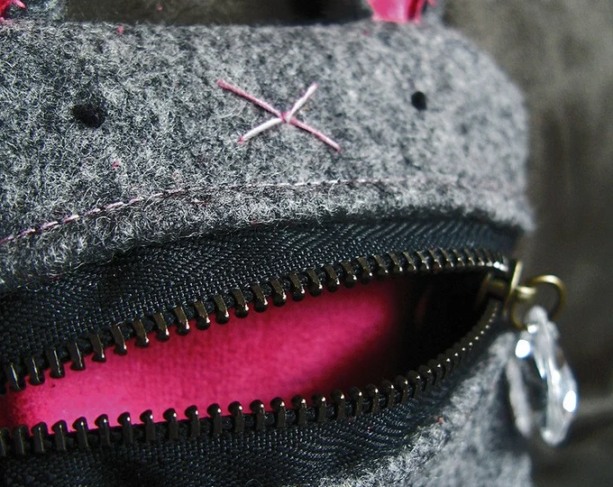 Grey felt bunny pouch with a zipper mouth and a crystal "drool" zipper pull