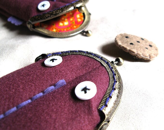 Pencil case in the shape of a purple salamander.