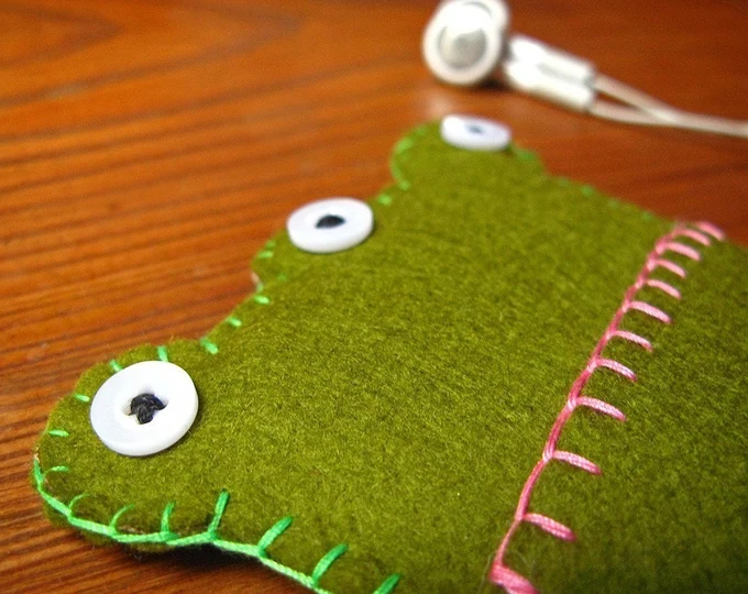 iPhone cozy in the shape of a 3-eyed frog