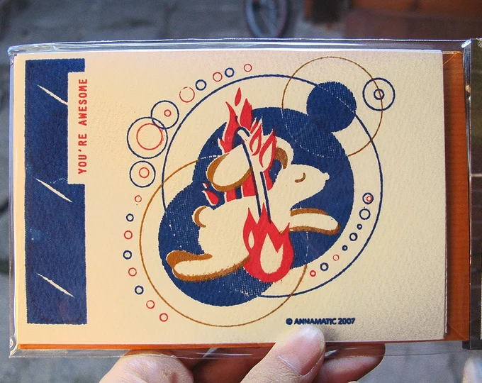 Riso print in dark blue, gold and red ink, of a bunny leaping through a burning halo