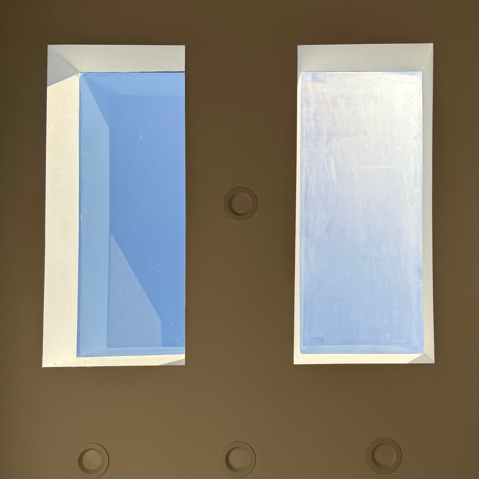 Residential window cleaning featuring   a before and after for a set of sun lights