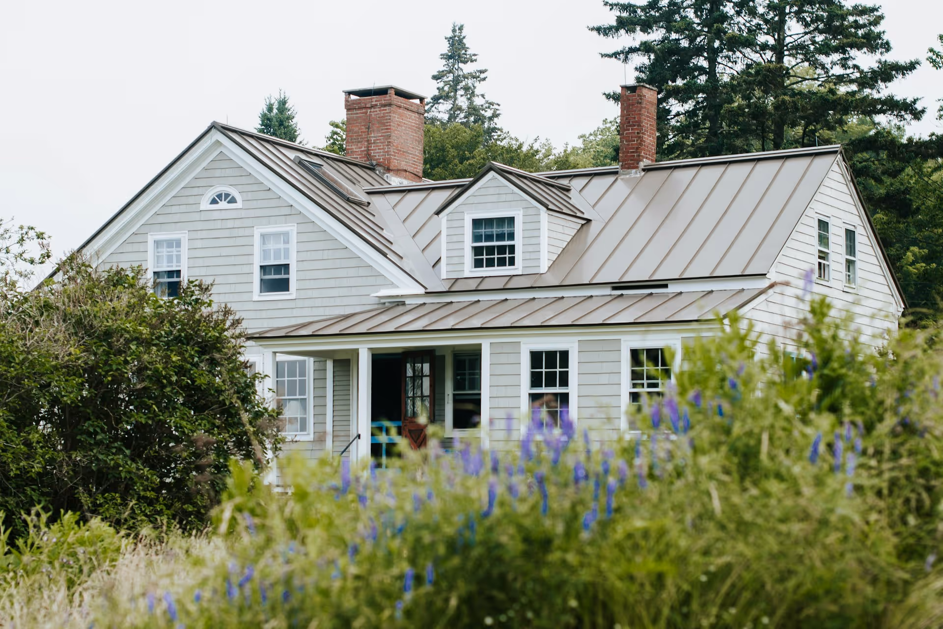 Traditional craftsman house on a wooded street