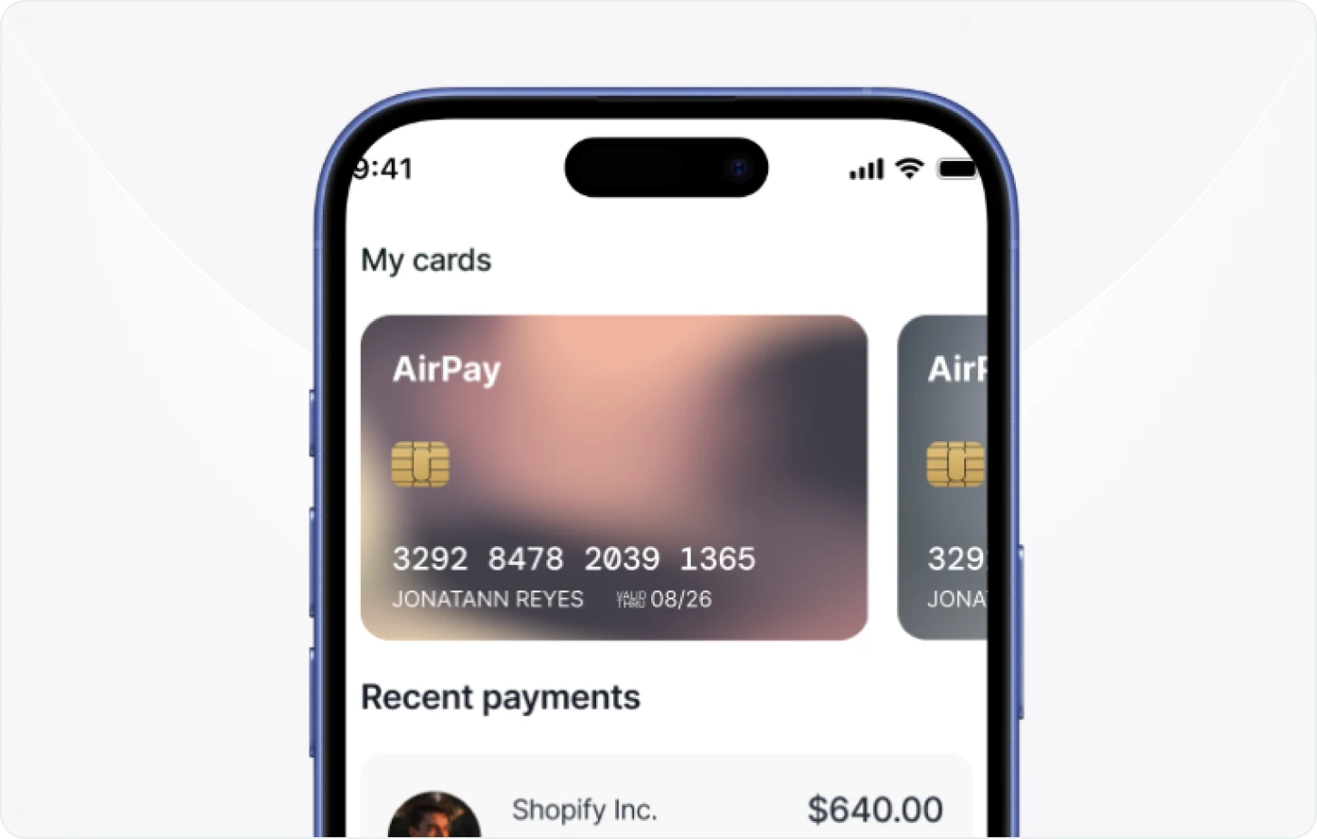 A cell phone with a credit card on the screen.