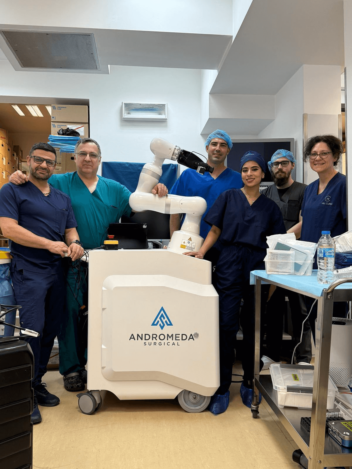 Andromeda Surgical team with their robotic system during global partnership announcement for clinical expansion.