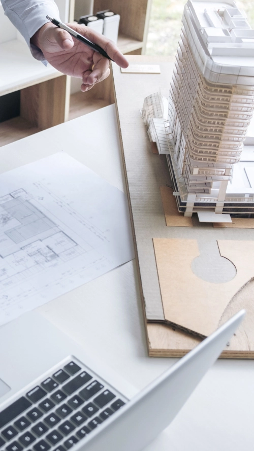 3D architectural digital models of buildings with data analytics interface overlay on a dark screen.