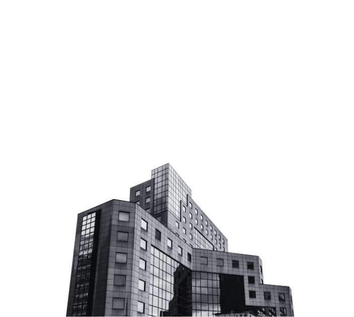 Low-angle view of a modern building corner with a geometric patterned facade.