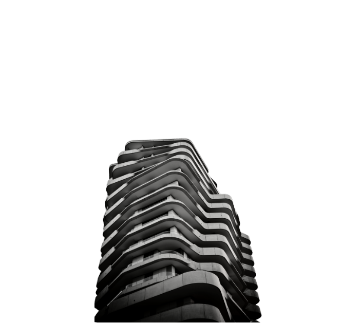 Black and white photo of a modern high-rise building with curved balconies against a dark background.