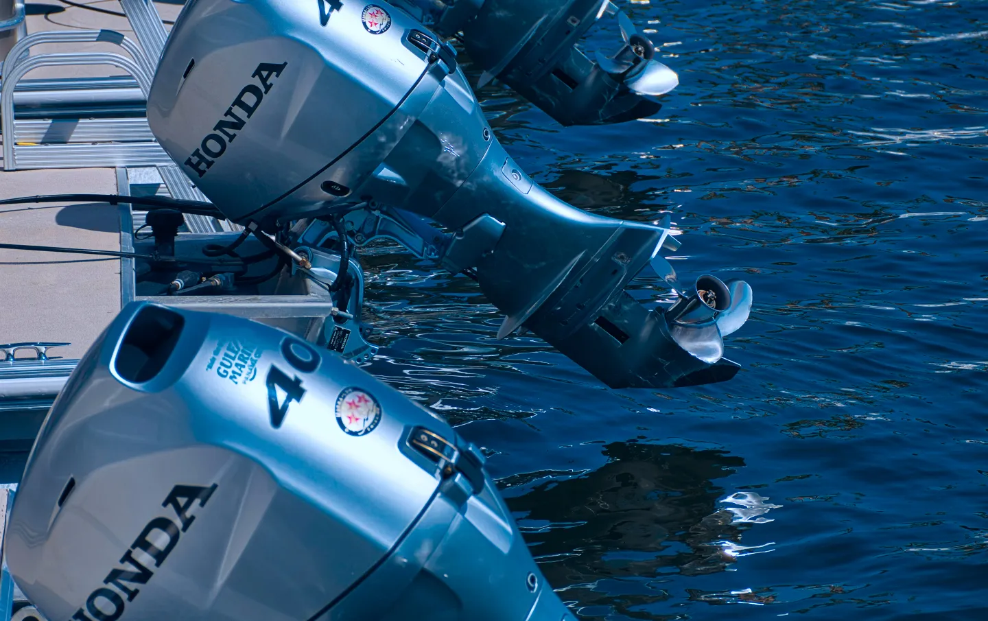 A row of motor boats sitting next to each other.