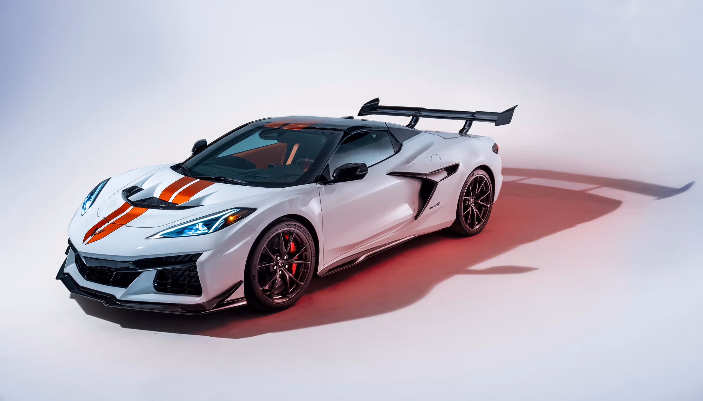 Three-quarter front view of the Corvette ZR1 showcasing aerodynamic lines, carbon wing, and performance stance.