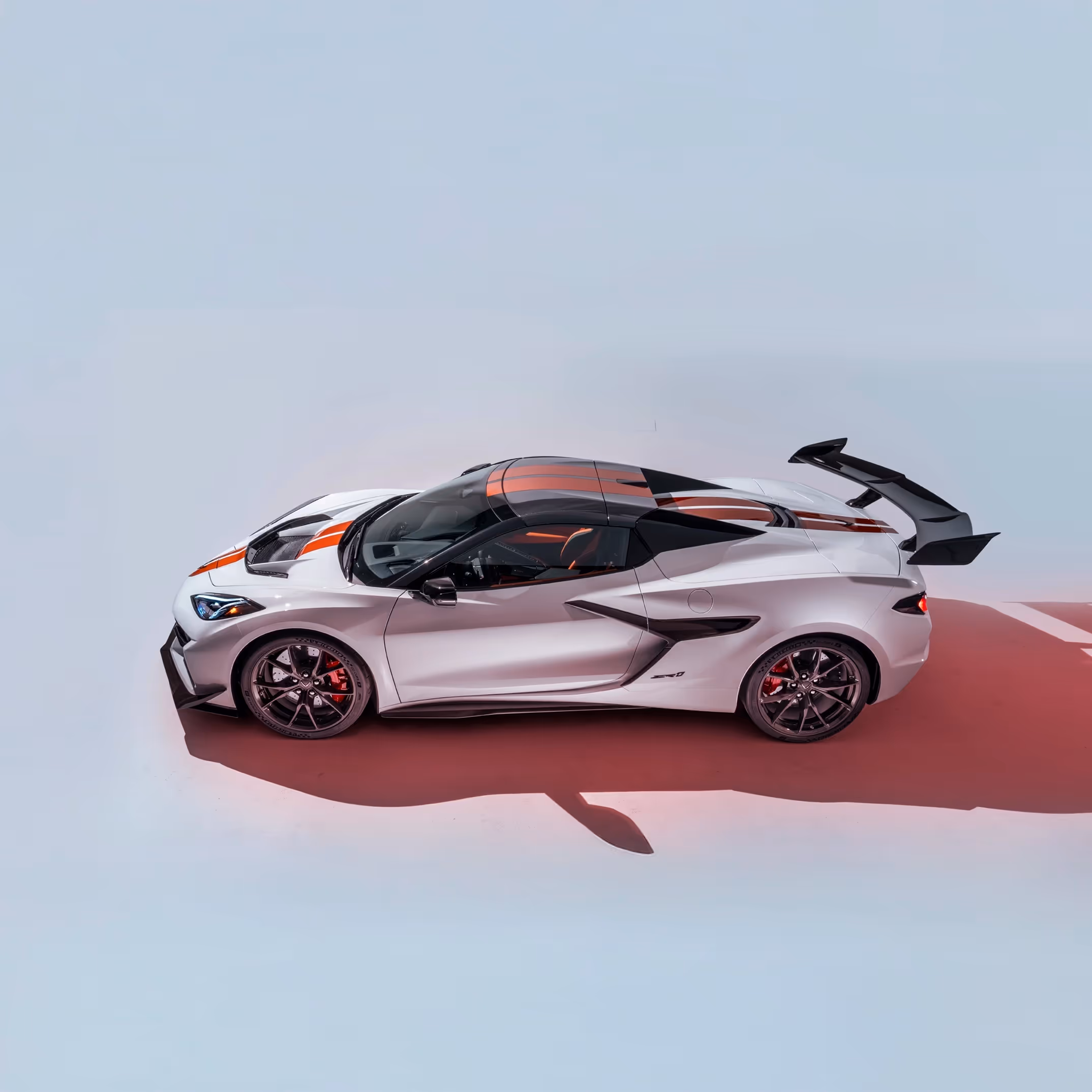 Side profile of the Corvette ZR1 in studio lighting highlighting sharp contours and carbon-fiber details.