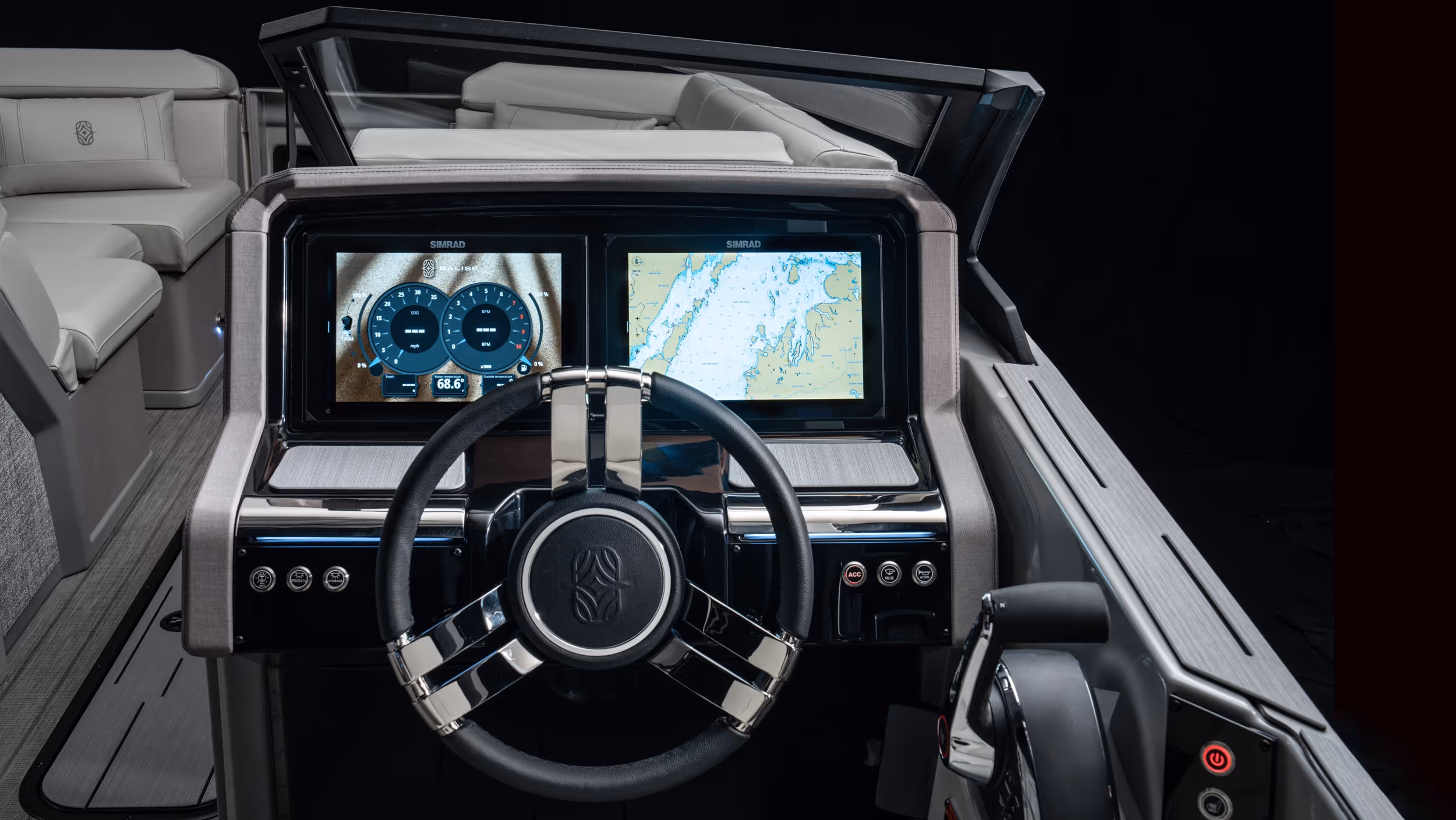Driver’s console featuring dual digital displays, chrome accents, and steering wheel under cool studio light.