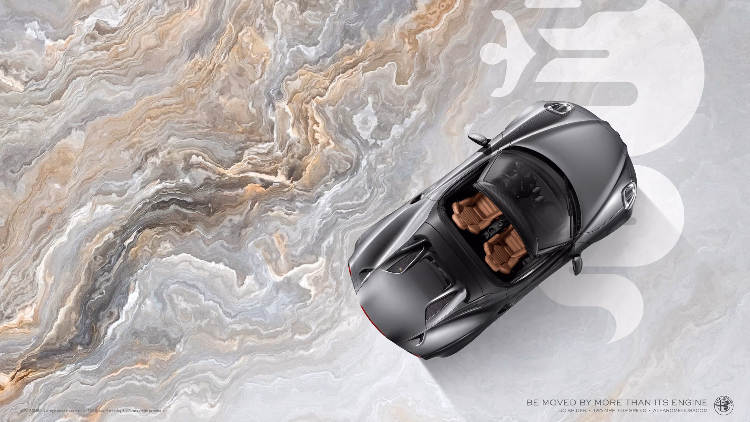 Overhead shot of graphite Alfa Romeo 4C on a swirling marble surface with a silver serpent emblem.