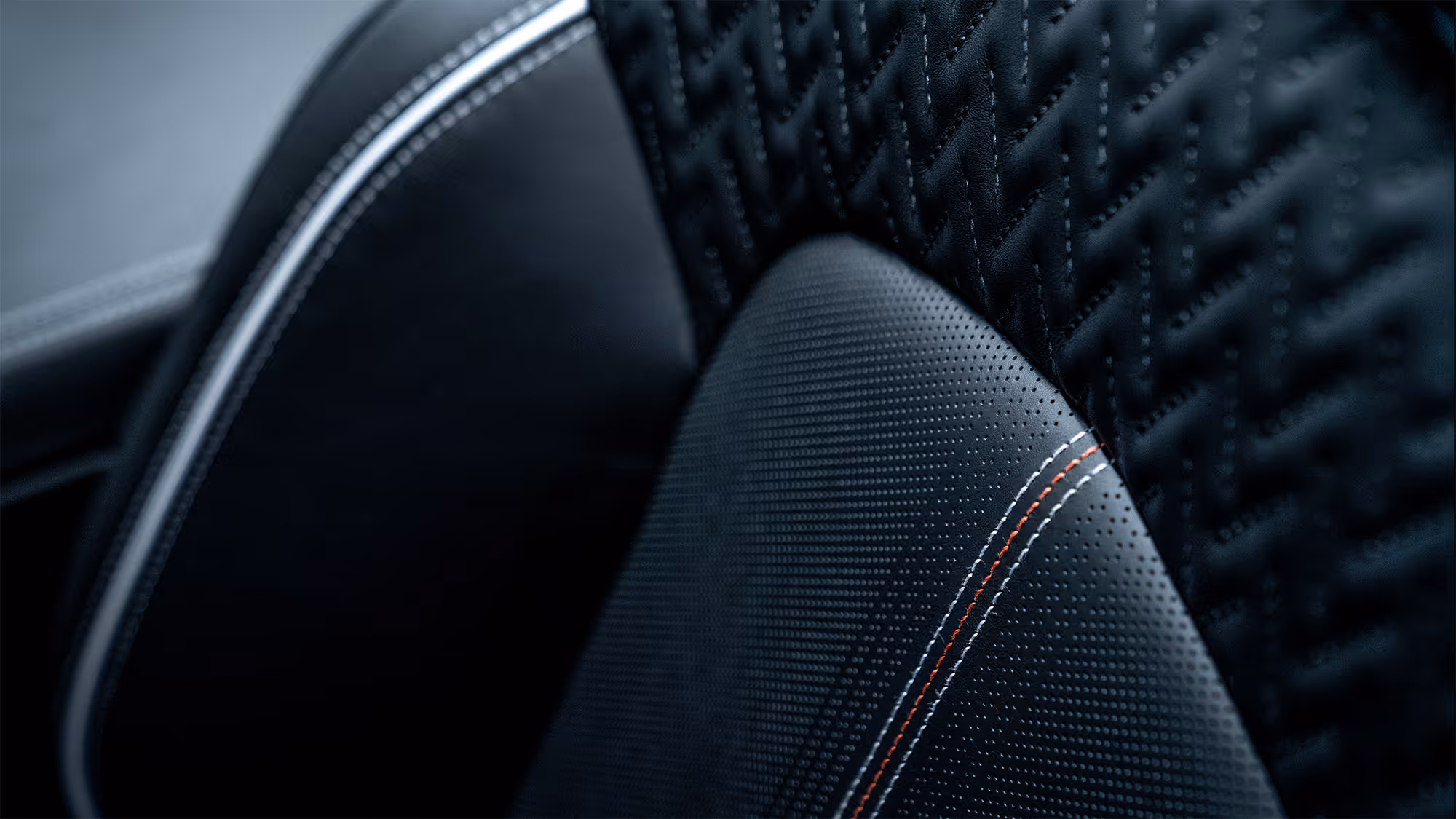 Macro detail of quilted leather performance seat with contrast stitching in Cadillac Blackwing interior.