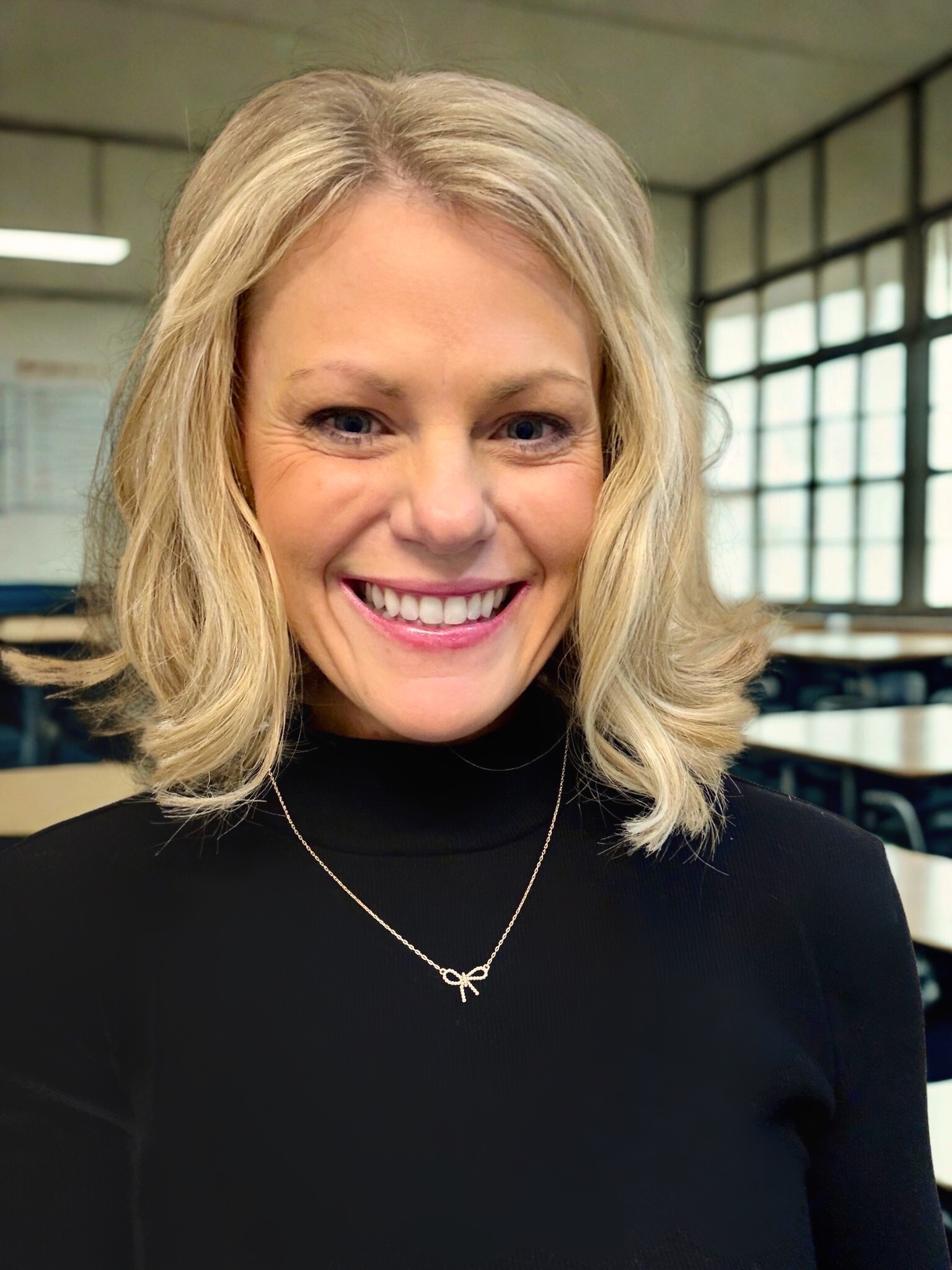 Megan Cales, Founder and CEO of Sensory Bridges, wearing the Brooks Band