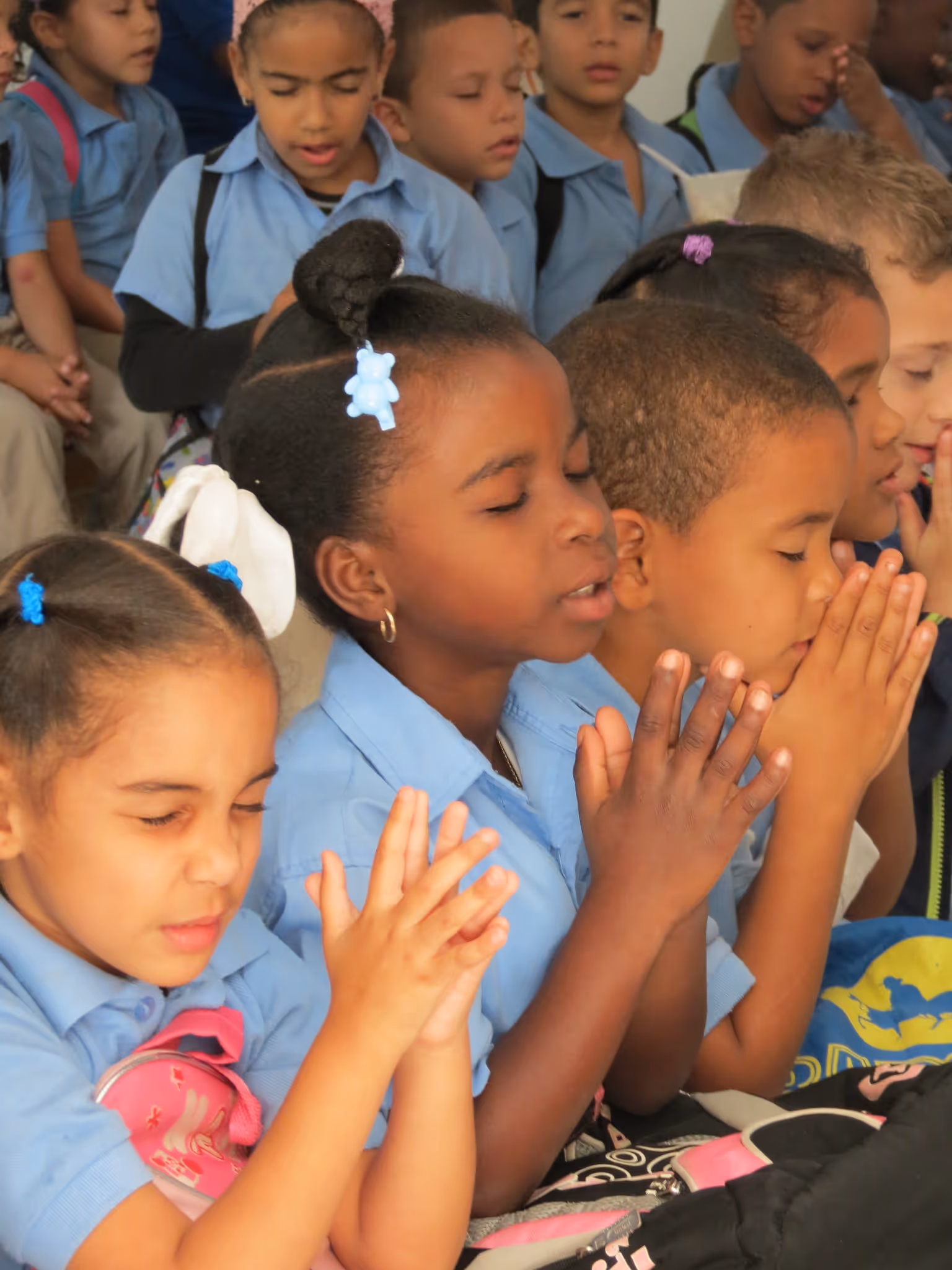 A person reads the bible overlooking a pond