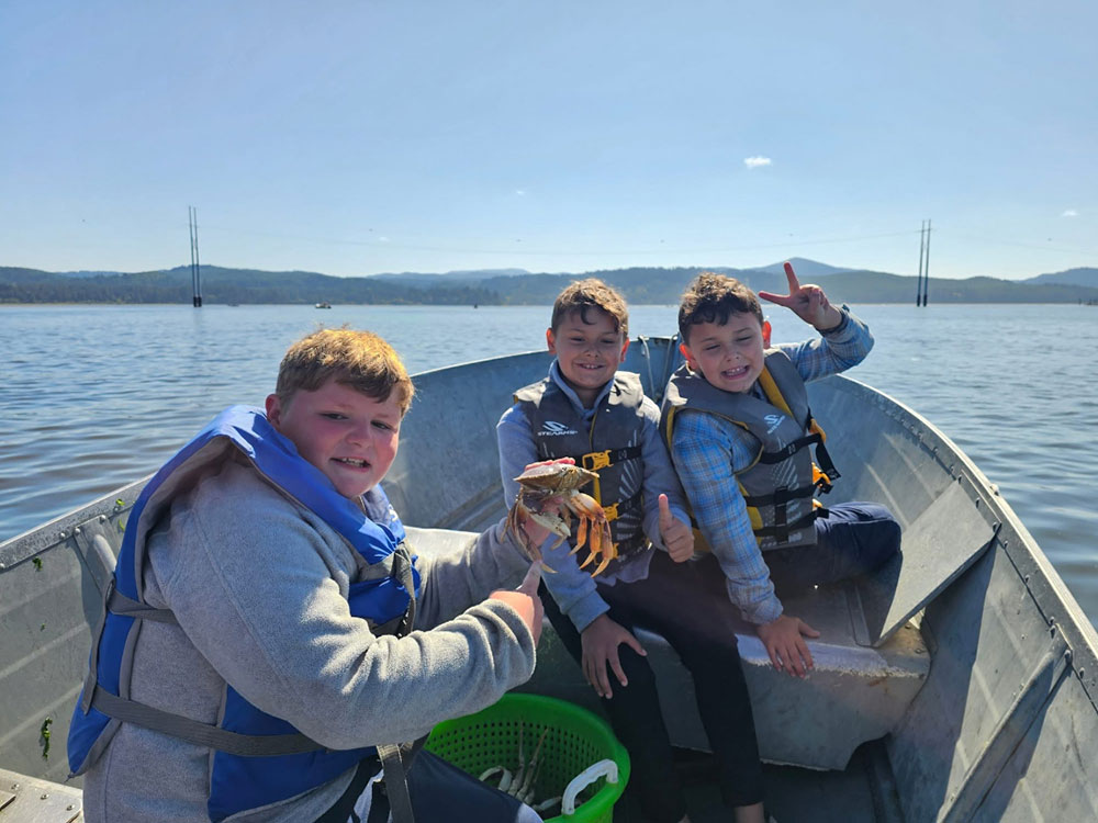 Boys on boat, crabbing