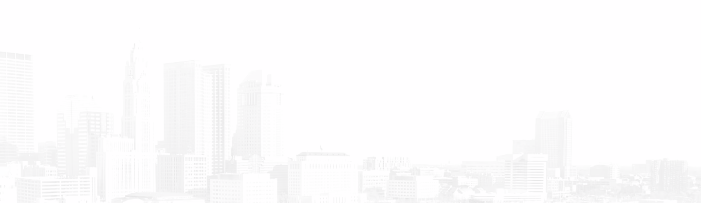 City skyline with various tall buildings and skyscrapers under a clear sky.