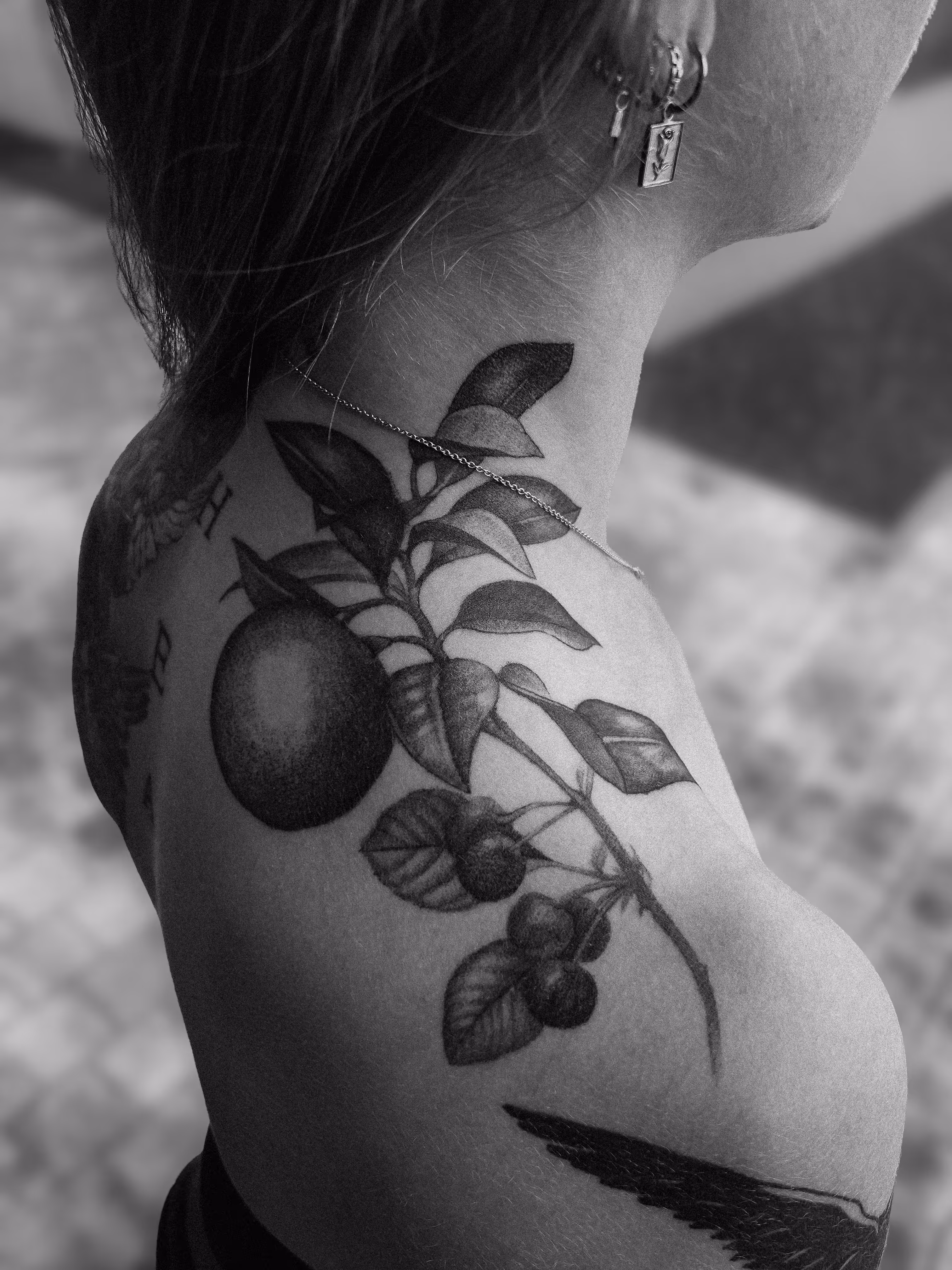 botanical tattoo on the shoulder