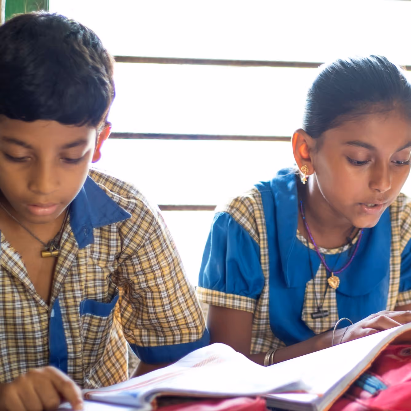 A boy and a girl in India studying