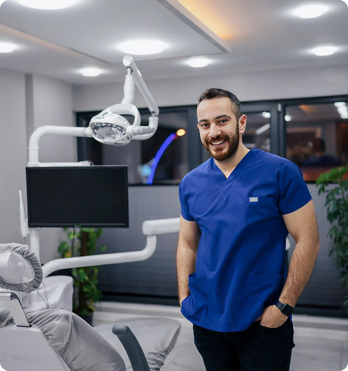 A dentist is smiling