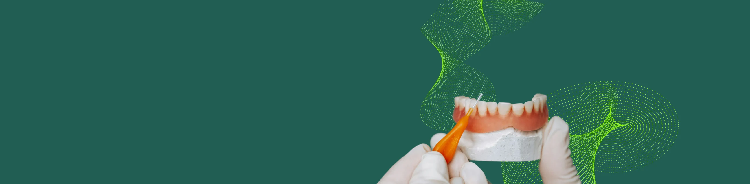 Gloved hands holding a dental model and an interdental brush against a green background with abstract dotted wave patterns.