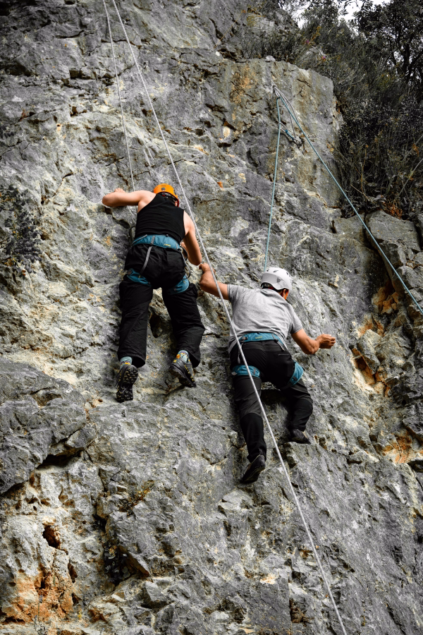 Two people climbing