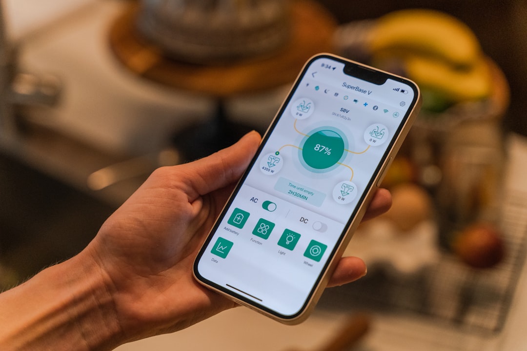 homeowner adjusting smart thermostat smartphone app homeowner adjusting smart thermostat smartphone app