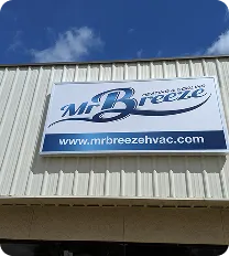 Mr. Breeze HVAC sign displayed on a building, promoting heating and cooling services.
