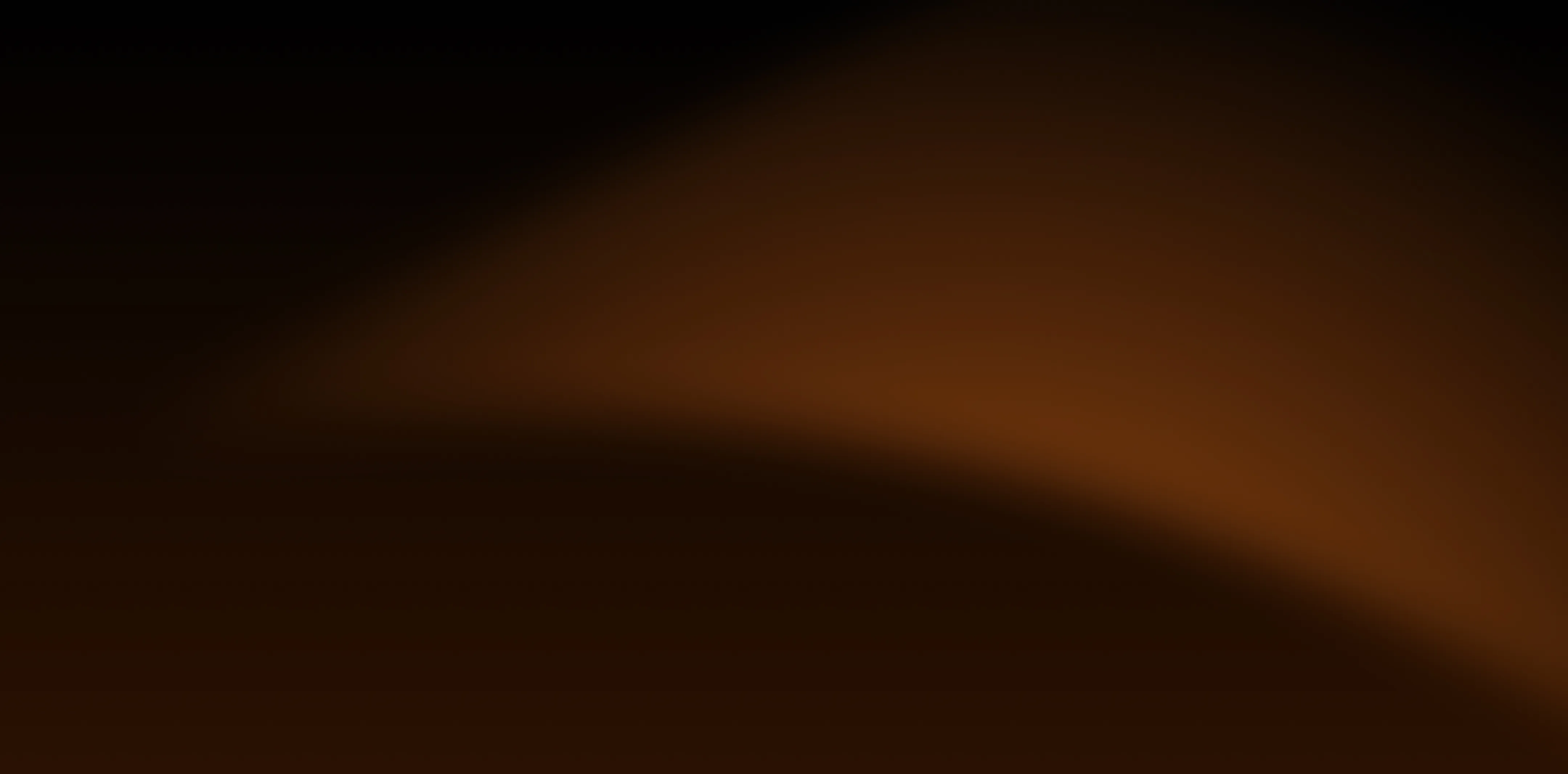 A blurry image of a black and brown background.