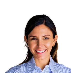 A woman wearing a blue shirt and smiling.