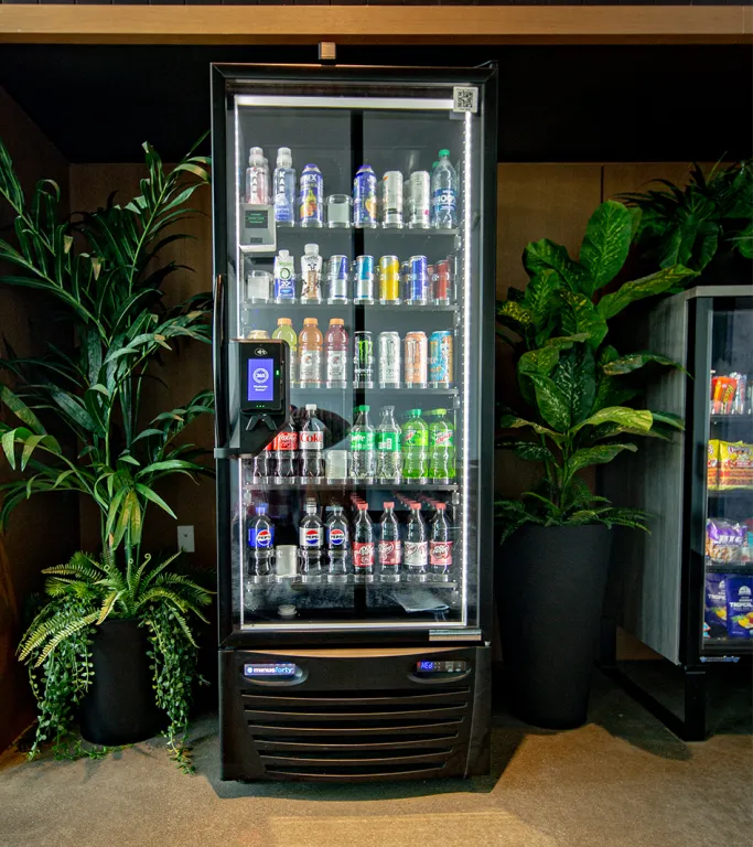 Compact healthy vending micromarket setup featuring a refrigerated display unit for small office breakrooms.