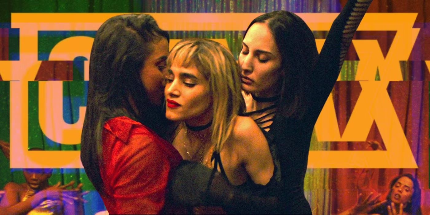 Three women closely embracing, with colorful abstract geometric shapes in the background. - screenshot of the film CLIMAX