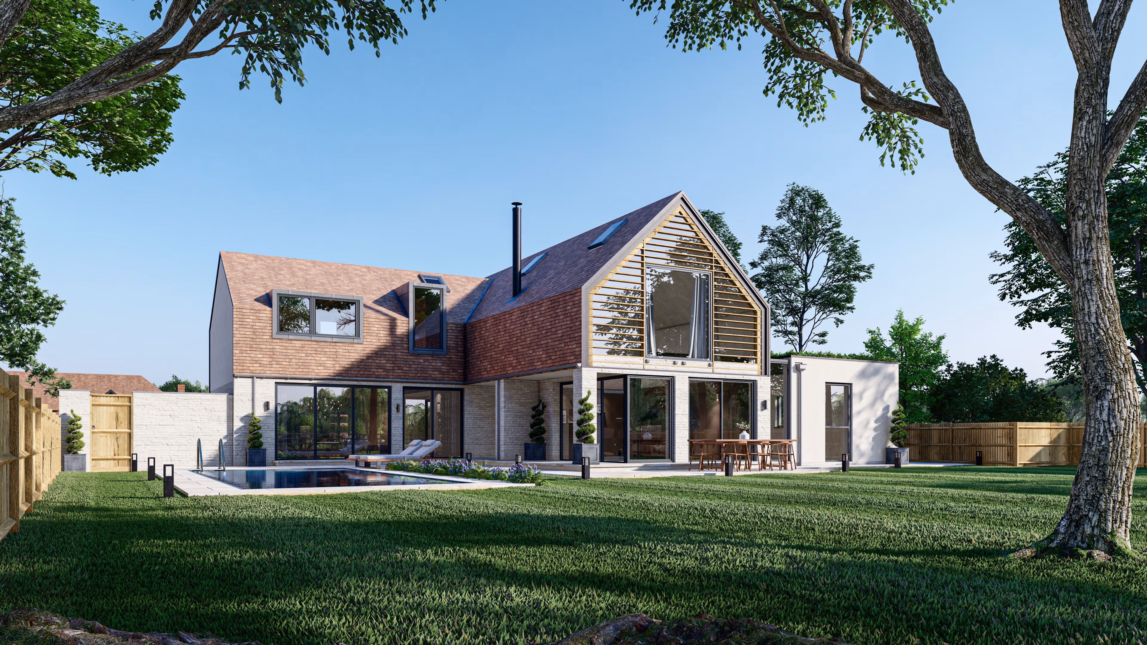 Modern two-story house with large windows, a patio with outdoor seating, swimming pool, and a spacious grassy yard with trees. Province Group Construction.