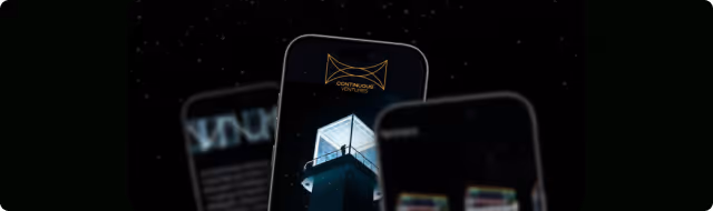 Close-up of smartphone screens showing a building and text in a dark setting.