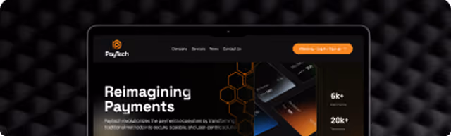 Laptop screen showing PayTech website with 'Reimagining Payments' heading and orange accents on dark background.