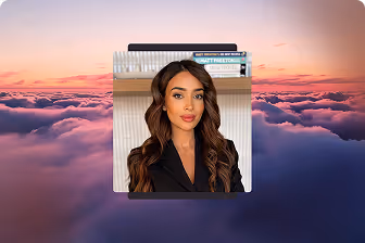 Portrait of a woman with long wavy hair wearing a black blazer against a backdrop of clouds at sunset.