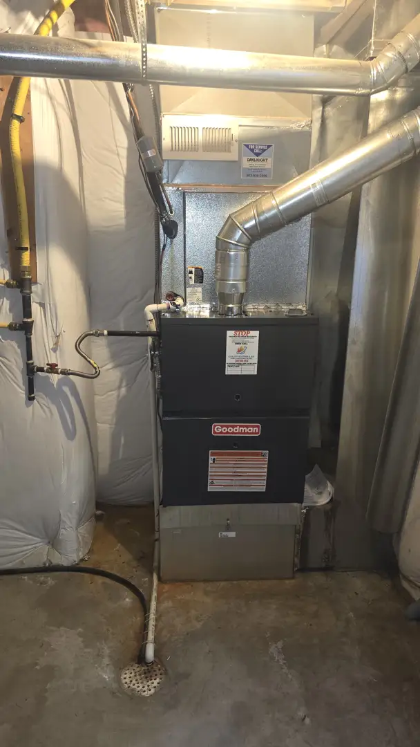 Technician inspecting a furnace system in a Thornton home - annual hvac maintenance is it worth it
