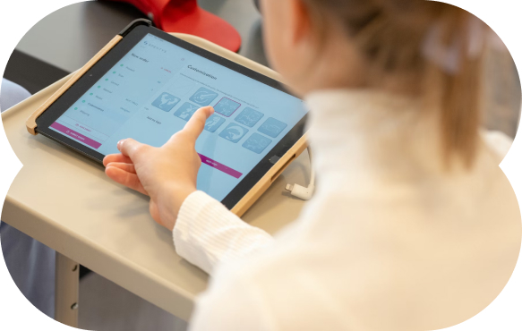 Person using a tablet with medical icons and options displayed on the screen.