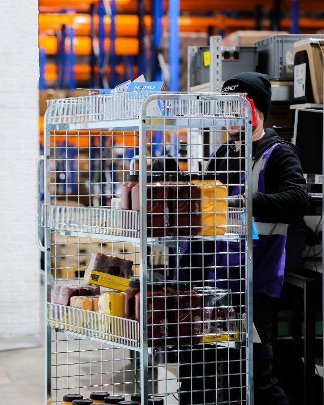 Man pushing product crate