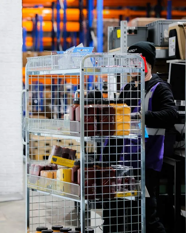 Man pushing product crate