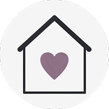 A round white icon with a house and a purple heart inside.