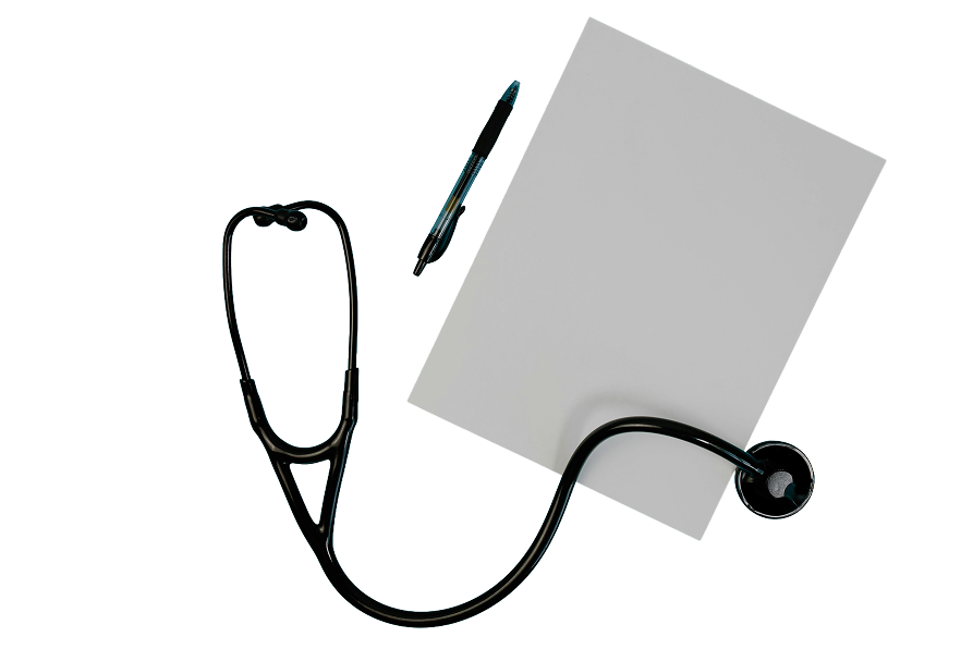 A blank piece of paper, pen, and stethoscope.