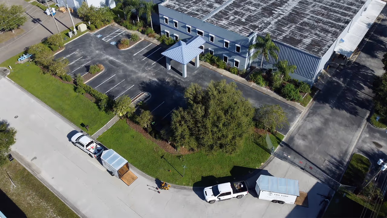 Aerial image from Tru Turf Pros mowing entrance to industrial building.